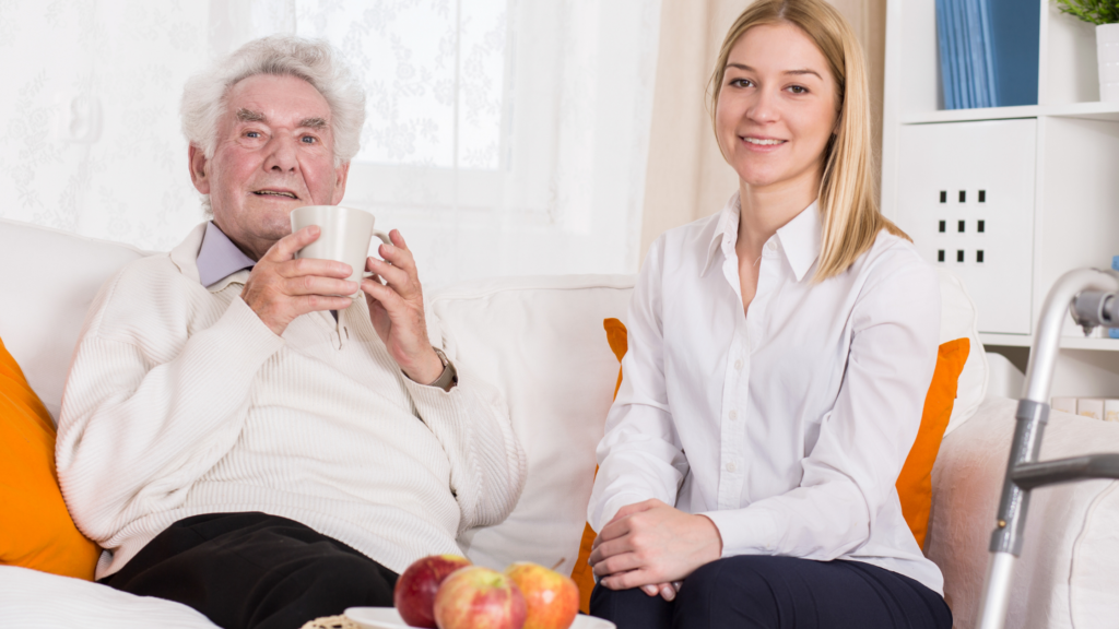 Caregiver helping an older adult stay warm and comfortable at home during winter.